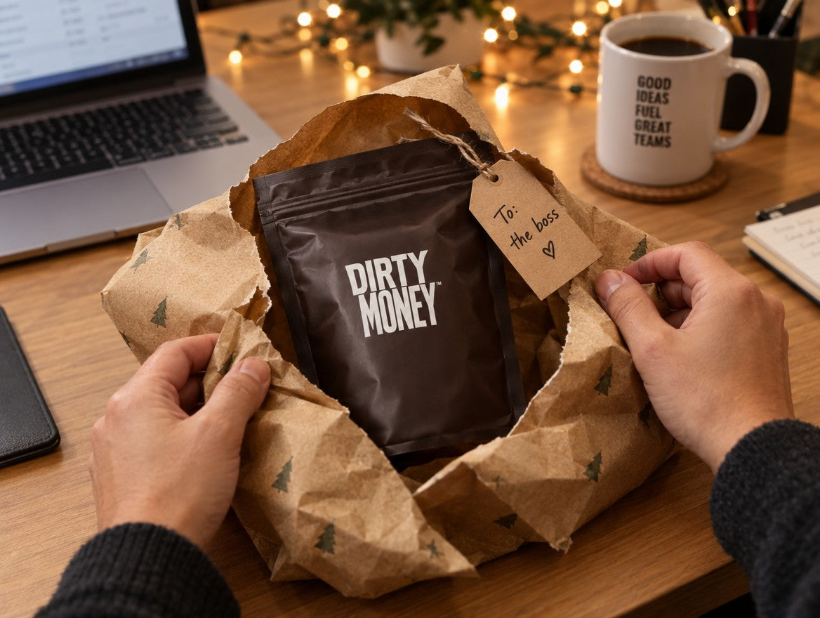 Hands unwrapping a DirtyMoney pack with a tag reading To: the boss