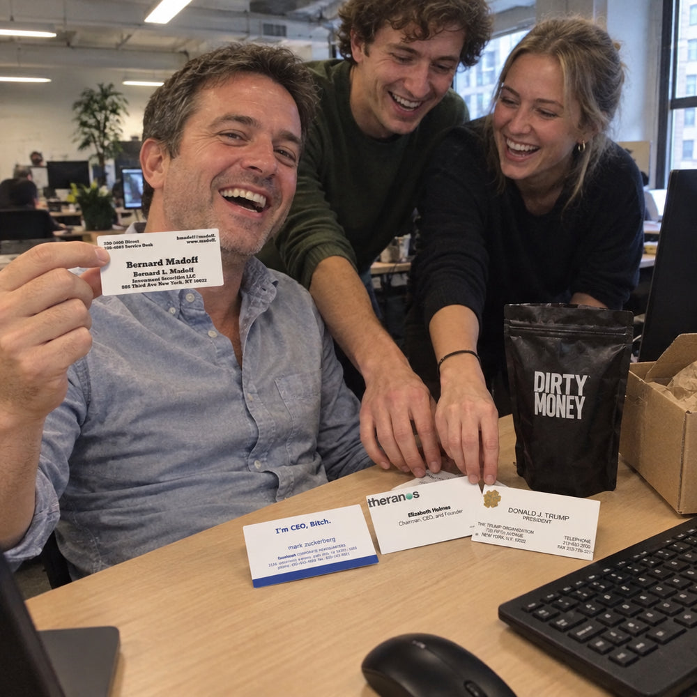 Colleagues grabbing cards off a desk